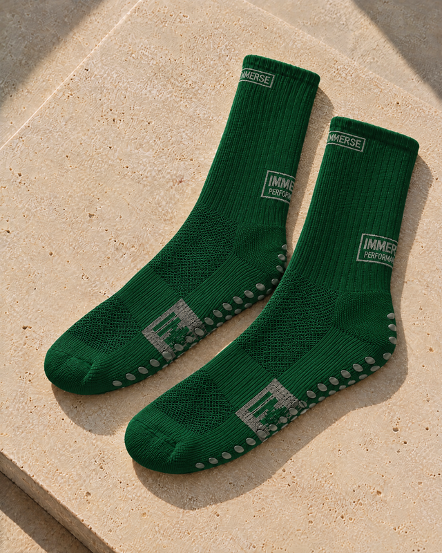 Immerse GRIP Crew Green, real product, laid on travertine