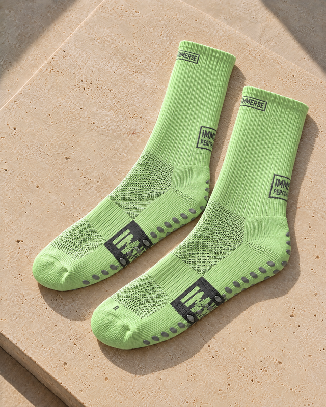 Immerse GRIP Crew Tea Green, real product, laid on travertine