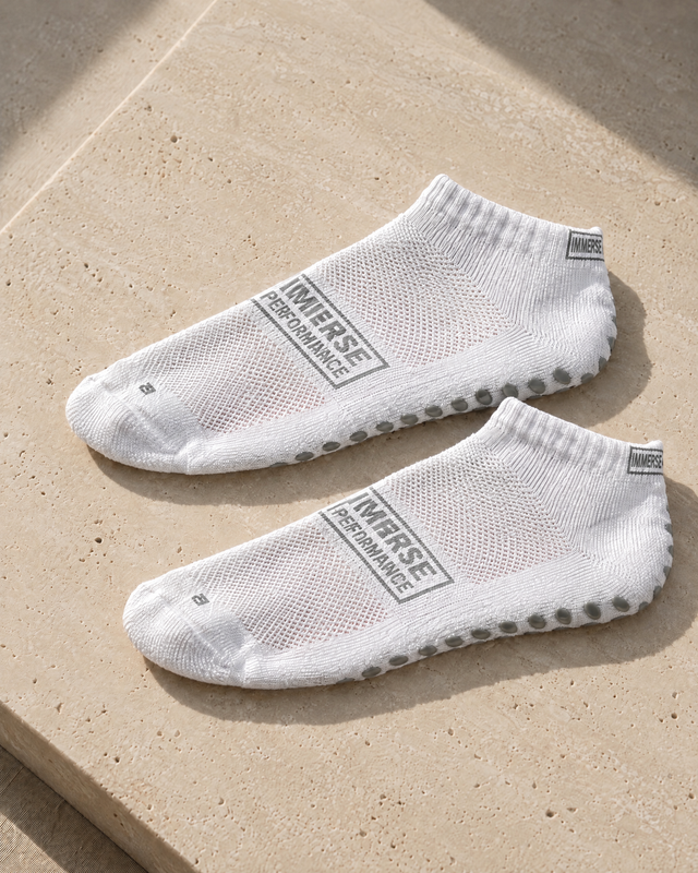 Immerse GRIP Ankle White, pair on travertine
